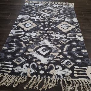 Blue metalic woven tufted fringe rug